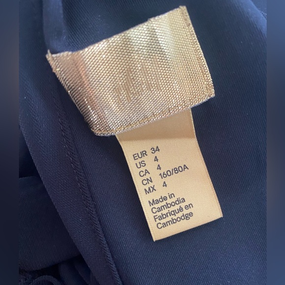 Deep V black dress with twist at waist - Picture 5 of 5